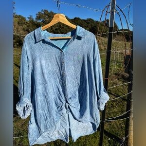 100% rayon loose button up, with tie, blouse. Size 2x